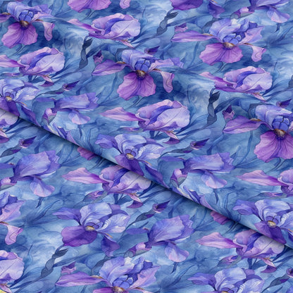 - Iris Bloom Floral Pattern 5 Quilting Cotton Fabric  
- Purple flowers  
- Lavender tones  
- Blue background  
- Botanical  
- Floral design  
- Quilting material  
- Soft texture  
- Cotton textile  
- Garden motif  
- Decorative fabric  
- Elegant blooms  
- Natural elements